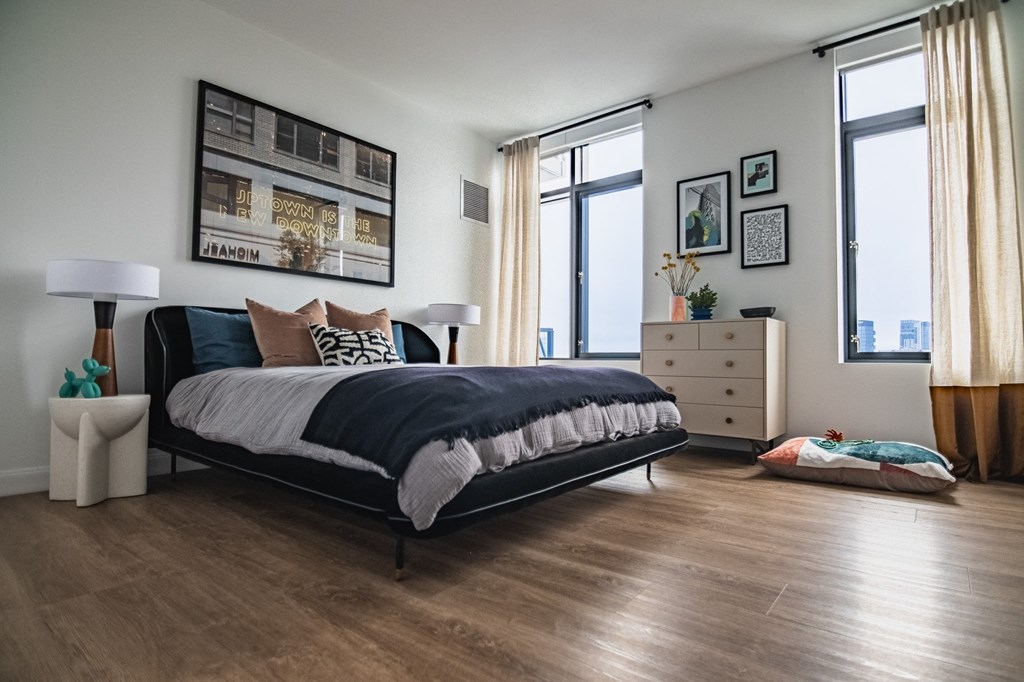 a bedroom with a bed and a dresser