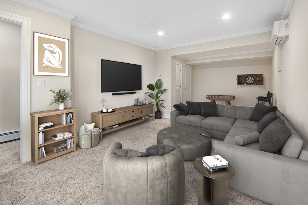 a living room with a couch and a tv