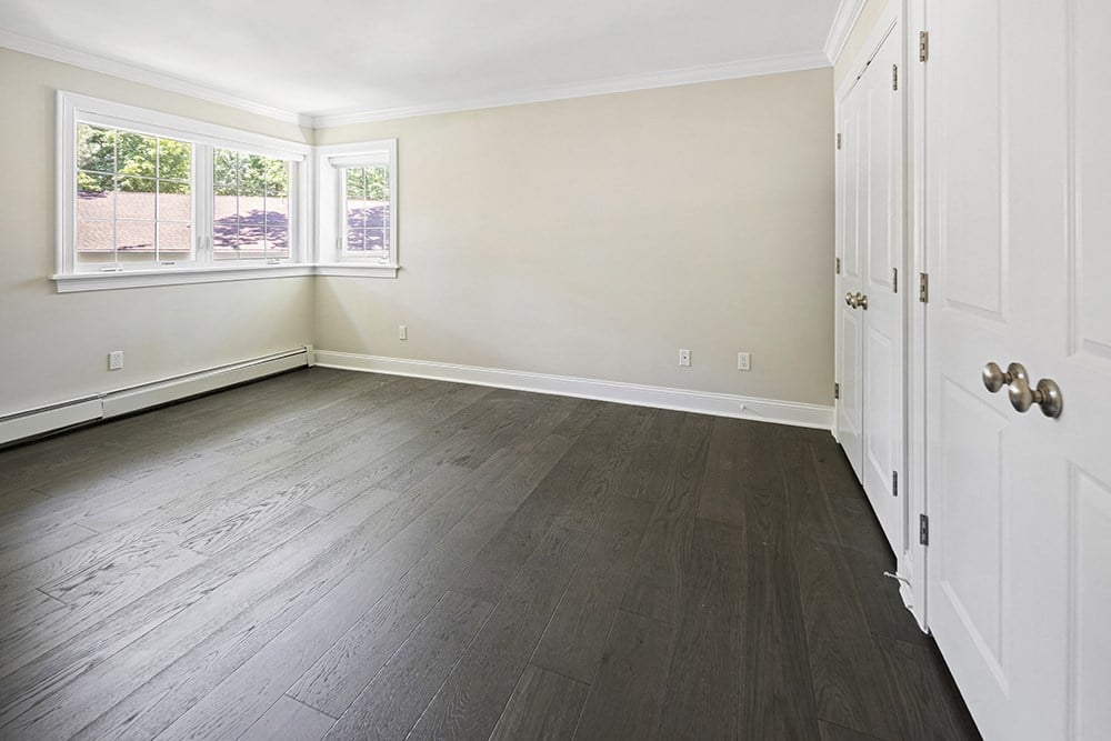 Newly renovated bedroom with new flooring and paint