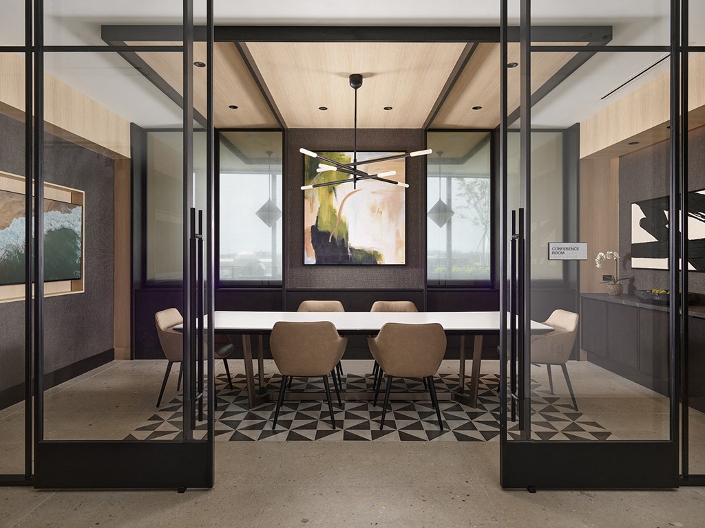 a rendering of a conference room with glass walls and a large table and chairs