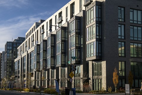 a row of apartment buildings on a city street