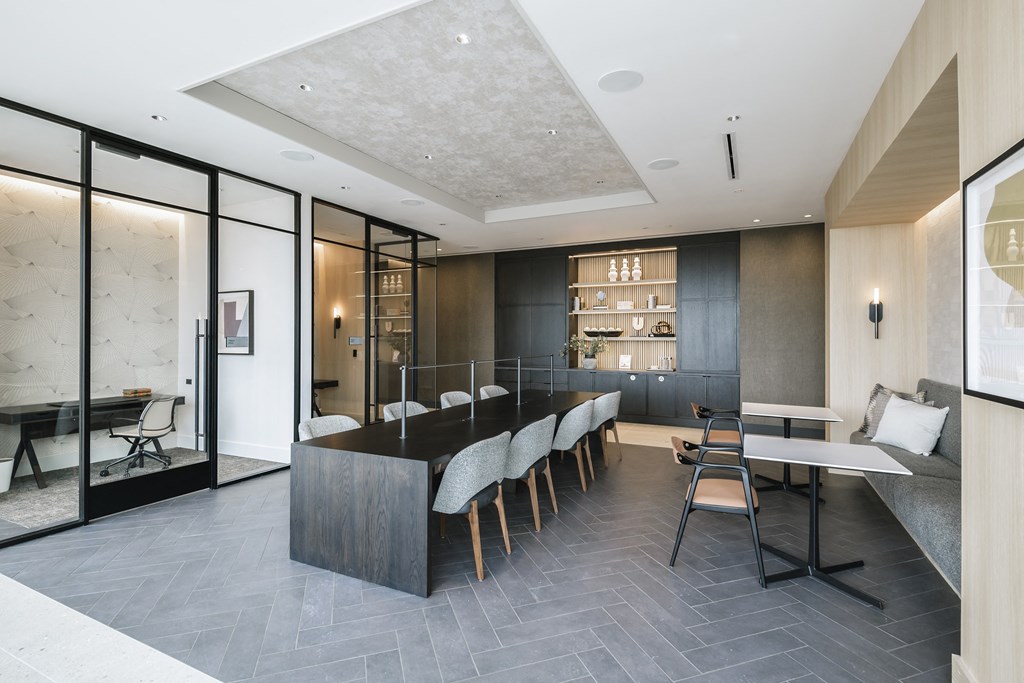 a large kitchen and dining room with a long table and chairs