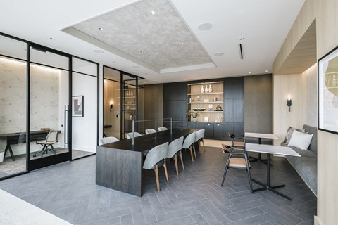 a large kitchen and dining room with a long table and chairs