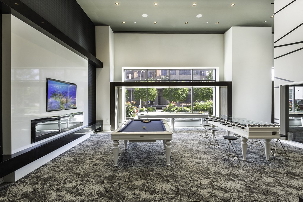 community game room with a pool table and a large window at Continuum, White Plains, NY