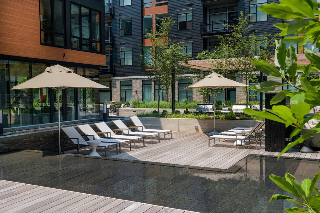 Outdoor Courtyard with Lounge Chairs and Water feature at Arrowwood Apartments, North Bethesda