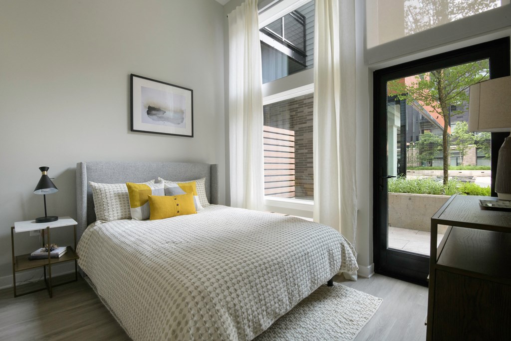 Comfortable Bedroom With Large Window at Arrowwood Apartments, North Bethesda, Maryland