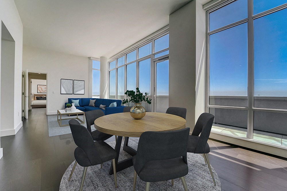 penthouse dining room with a table and chairs in front of a window with a view of the at Continuum, White Plains, NY, 10606