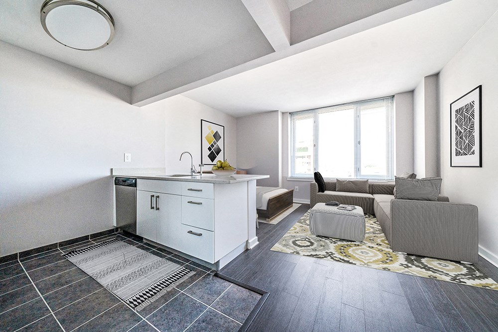a living room with a kitchen and a couch at 34 Berry, Brooklyn, 11249