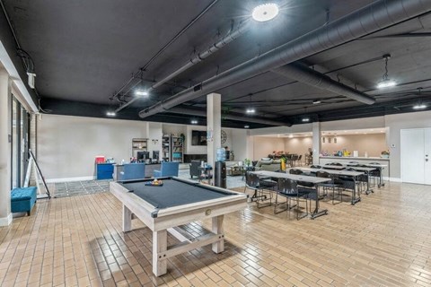 Community game room with pool table and dining tables at Crystal View Apartments, Garden Grove, CA 92840