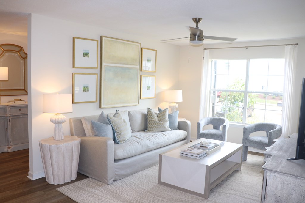 a living room with a couch and a coffee table at Vineyard at Castlewoods in Brandon, MS