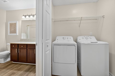 A laundry room with a washer and dryer.