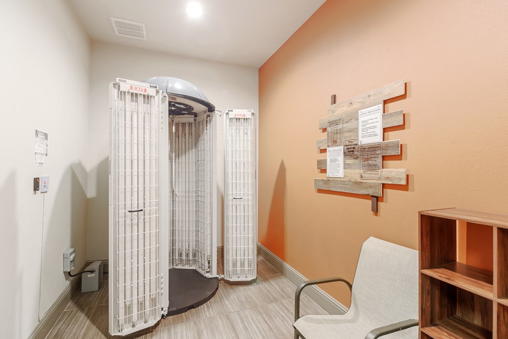 a patient room in a hospital with a shower and a chair at Cumberland Place Apartment Homes, Texas 75703