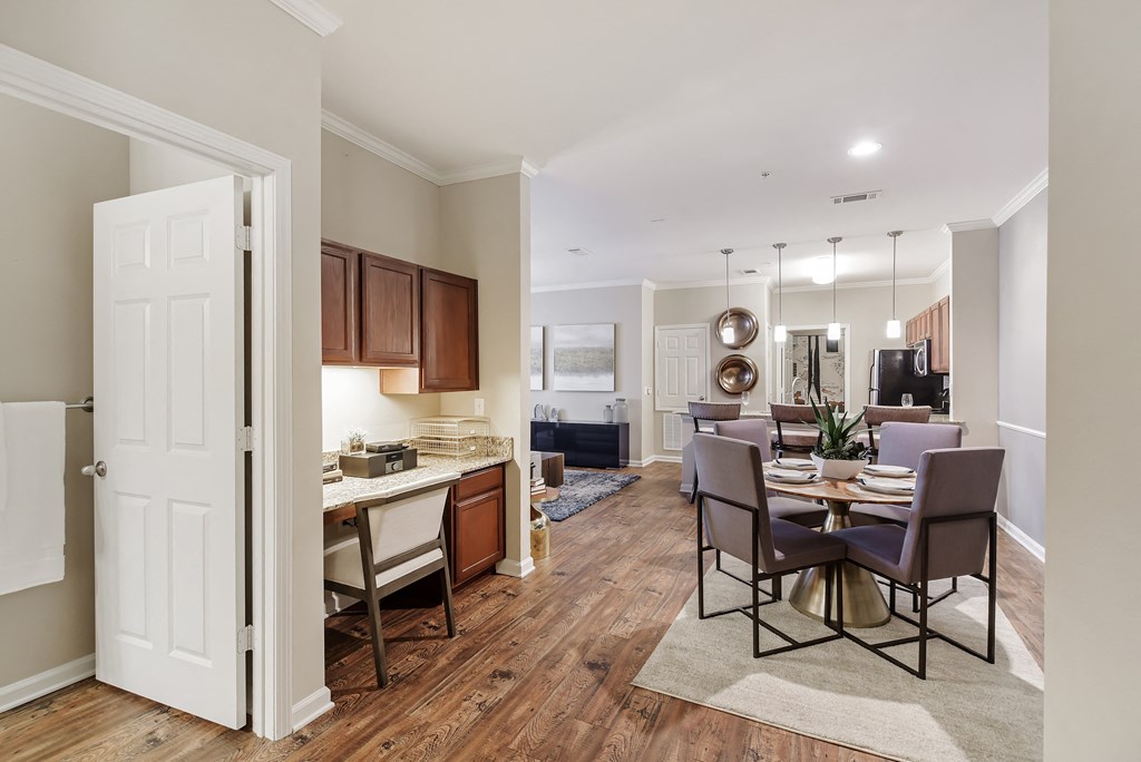 a living room and dining room at Cumberland Place Apartment Homes, Tyler, TX
