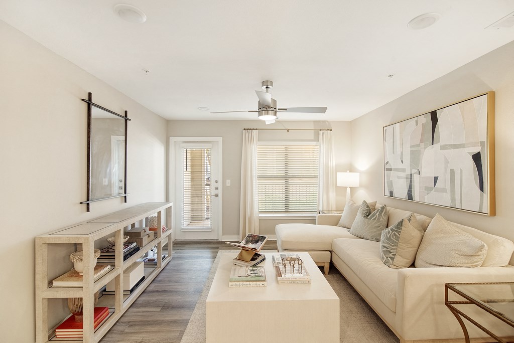 a living room with a couch and a coffee table at The Azul Apartment Homes in Oxford, MS 38655