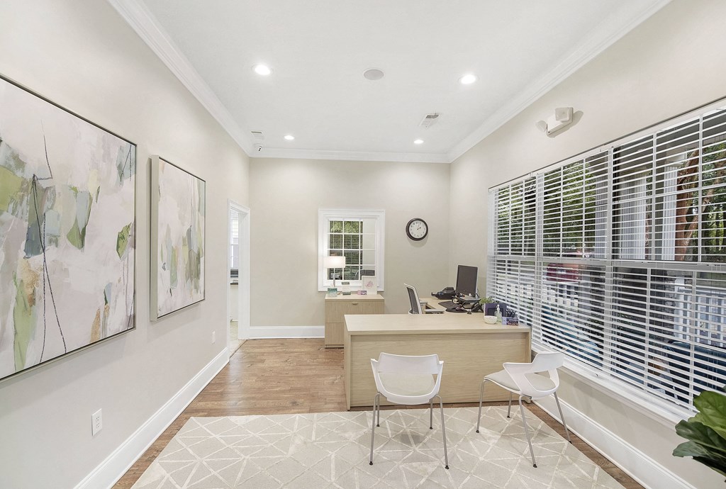 Home office with a desk and chairs and a large window at Highlands Apartment Homes, Bartlett, TN