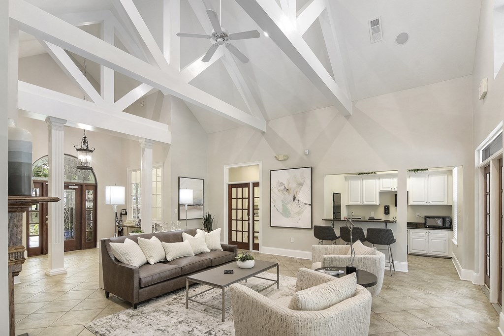 Clubhouse with couch and kitchen at Highlands Apartment Homes, Bartlett, TN, Tennessee , 38135