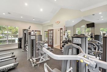 Fitness center with cardio equipment at Highlands Apartment Homes, Tennessee , 38135