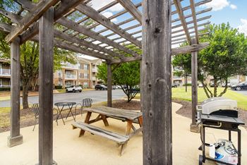 Picnic tables and grill at Highlands Apartment Homes, Bartlett, TN