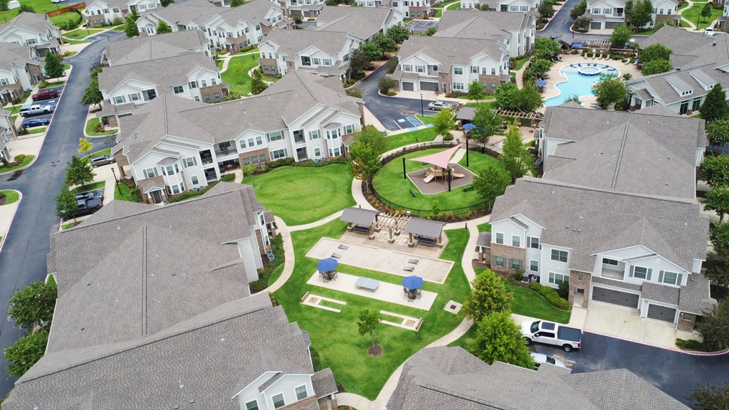 an aerial view of a neighborhood with houses and a fountain at Kingston Crossing Apartment Homes, Bossier City, LA, Louisiana