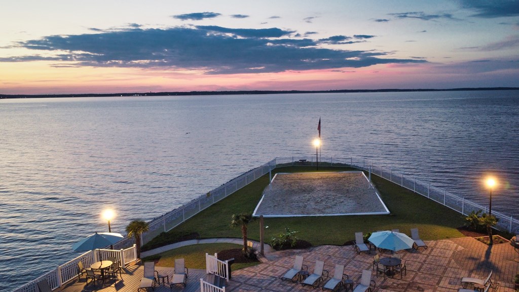 a view of the pool and the water at dusk  at Lakeshore Pointe Apartment Homes, Brandon
