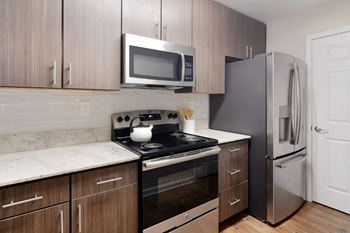 a kitchen with a stove refrigerator and microwave  at Bridgewater Apartment Homes, Brandon, 39047