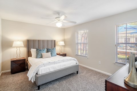 a bedroom with a bed and a ceiling fan at Bridgewater Apartment Homes, Brandon