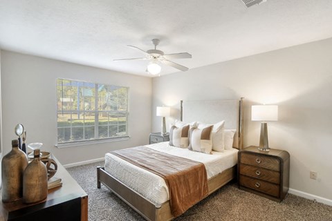 a bedroom with a bed and a ceiling fan  at Bridgewater Apartment Homes, Brandon, MS, 39047