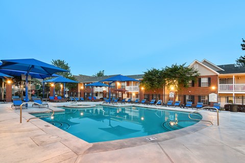 our resort style swimming pool is lit up at night at Bridgewater Apartment Homes, Brandon, 39047