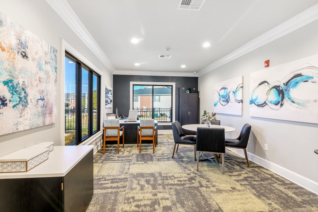 a dining room with a table and chairs and a large window at Crossgates Apartment Homes, Mississippi 39759