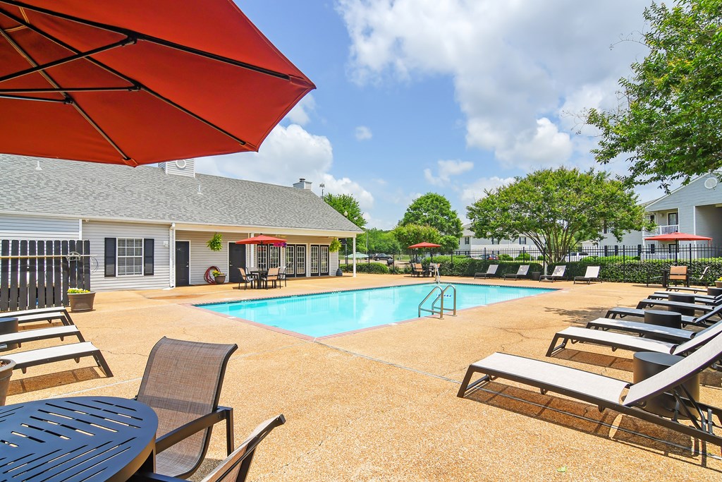 our resort style pool is filled with lounge chairs and tables at The Colony Apartment Homes, Columbus, 39702
