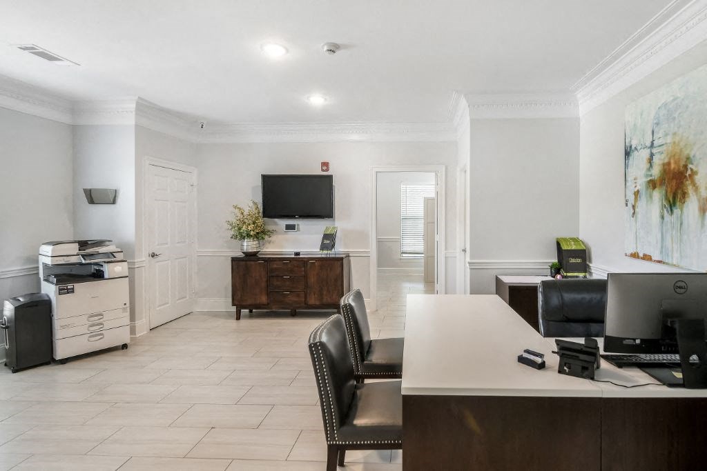 Room with wooden furnitureat Avalon Apartment Homes, Mississippi, 39759