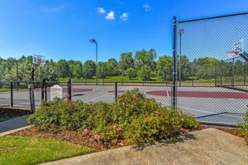 Lighted basketball court at Avalon Apartment Homes in Starkville, 39759