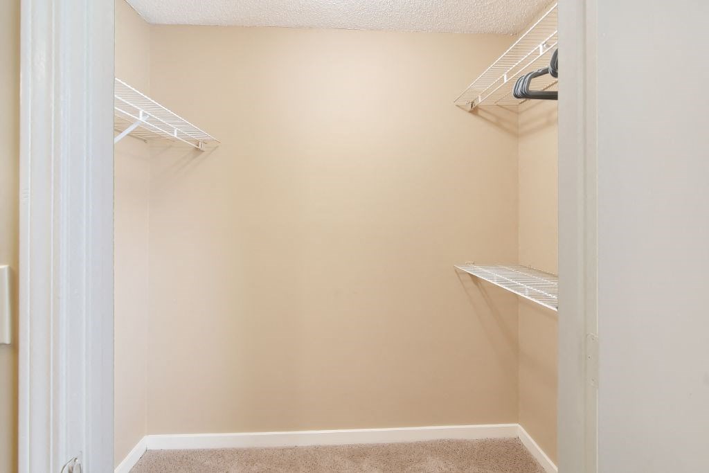 a walk in closet in a 555 waverly unit at The Colony Apartment Homes, Columbus, MS, 39702