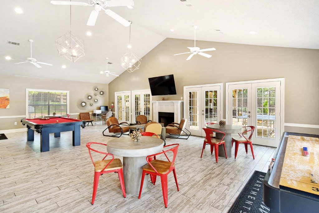 a recreation room with a pool table and foosball table at Lexington Pointe Apartment Homes, Oxford, 38655