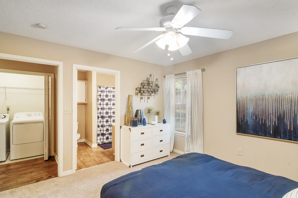 a bedroom with a bed and a ceiling fan at Lexington Pointe Apartment Homes in MS 38655