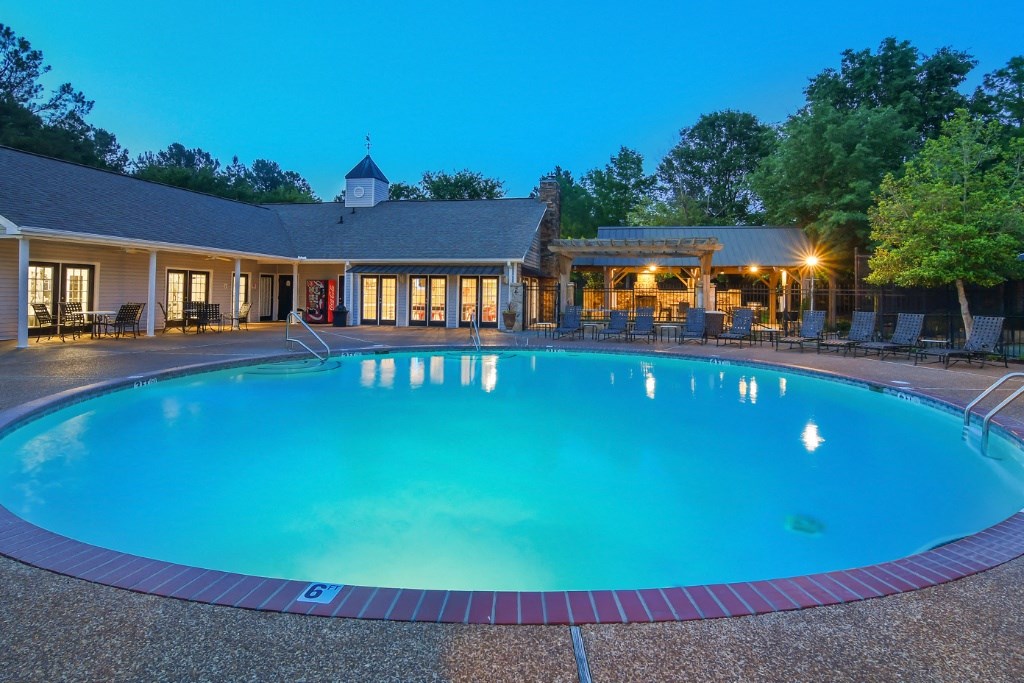 a large swimming pool with a hotel in the background at Lexington Pointe Apartment Homes, Oxford