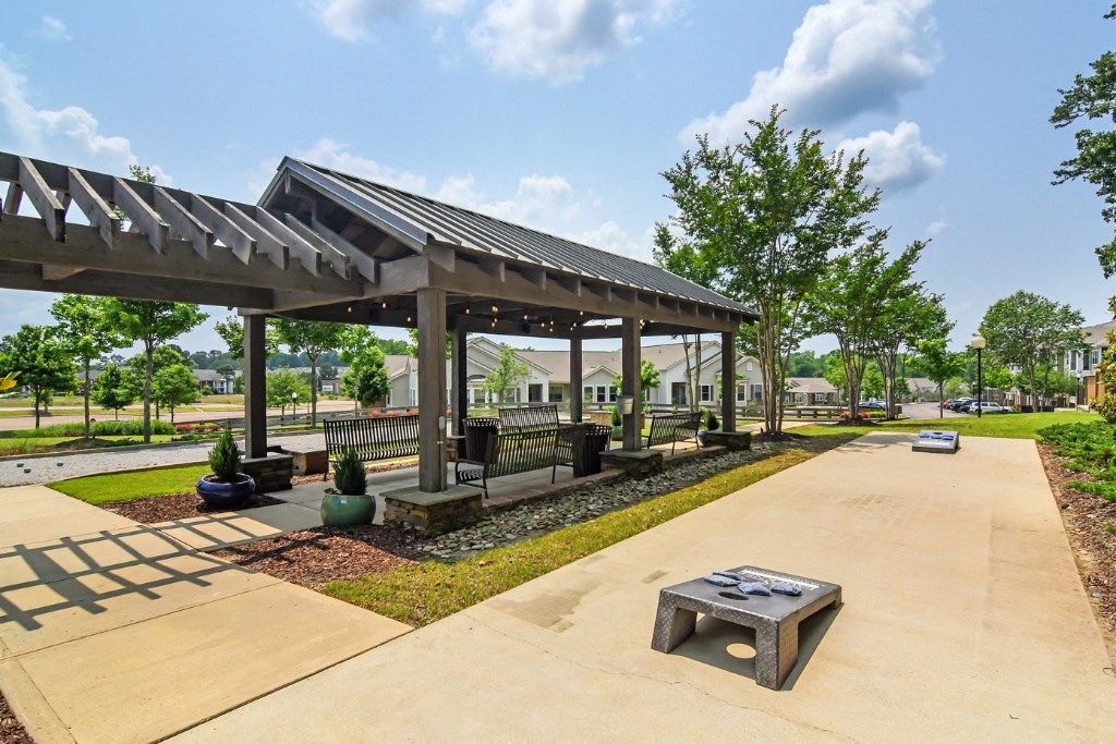 a picnic shelter with a firepit at Faulkner Flats Apartment Homes, Mississippi, 38655