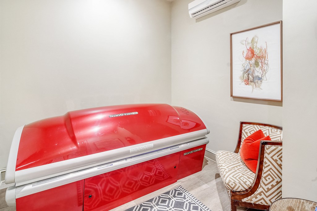 the spa has a red jetted tub in the corner of the room at Cambridge Station Apartment Homes, Mississippi