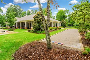 a house with a yard and a sidewalk in front of it at Cambridge Station Apartment Homes, Mississippi, 38655