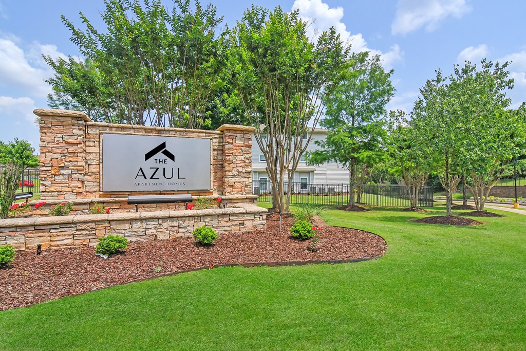 monument sign with trees and grass at The Azul Apartment Homes in Oxford, Mississippi 38655