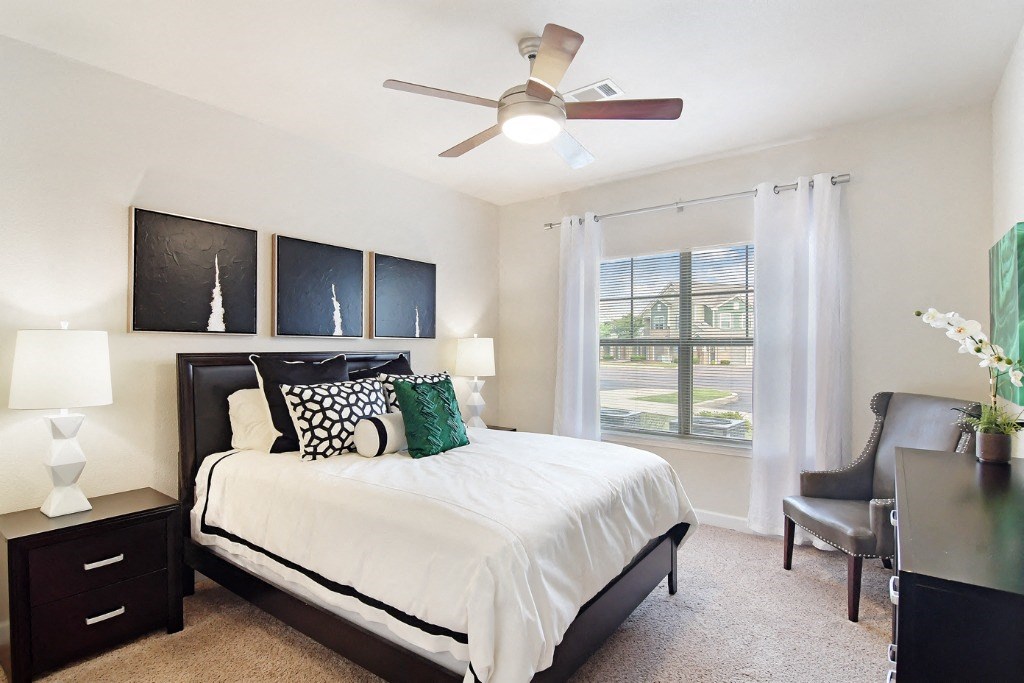 our apartments offer a bedroom with a king size bed at Faulkner Flats Apartment Homes, Oxford