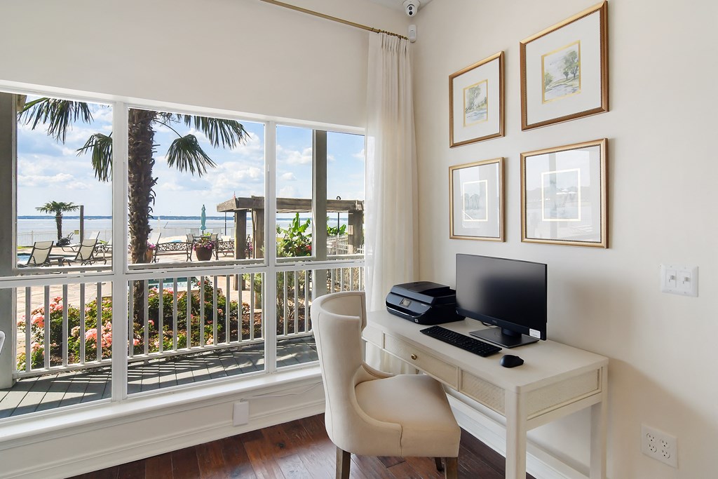 a home office with a desk and a view of the beach at Lakeshore Pointe Apartment Homes, Mississippi, 39047