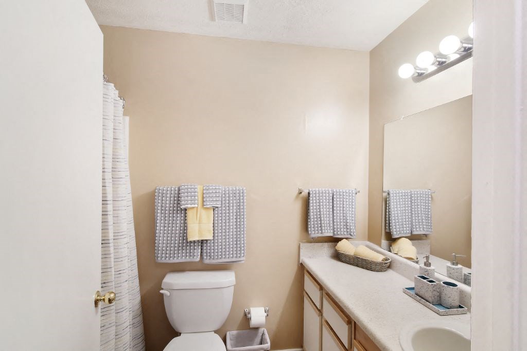 our apartments offer a bathroom with a shower  at Parklane Apartment Homes, McComb, Mississippi