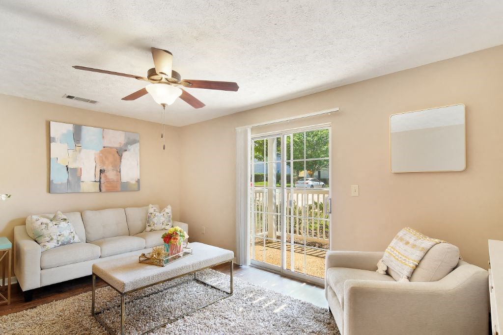 a living room with two couches and a coffee table  at Parklane Apartment Homes, McComb