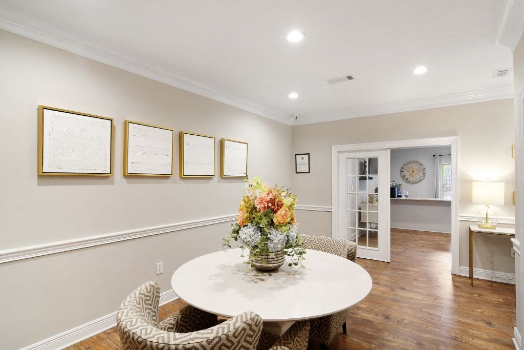 a dining room with a table and chairs  at Parklane Apartment Homes, McComb