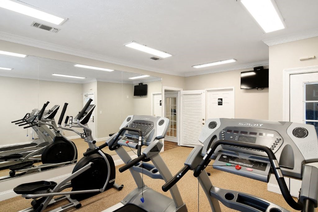 our apartments have a gym with a treadmill and elliptical machines  at Parklane Apartment Homes, McComb, Mississippi