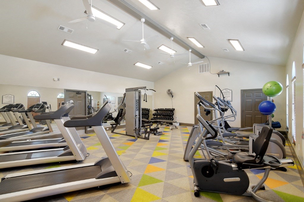 a fitness center with treadmills and other exercise equipment  at Landing at Willow Bayou Apartment Homes, Bossier City, LA, 71111