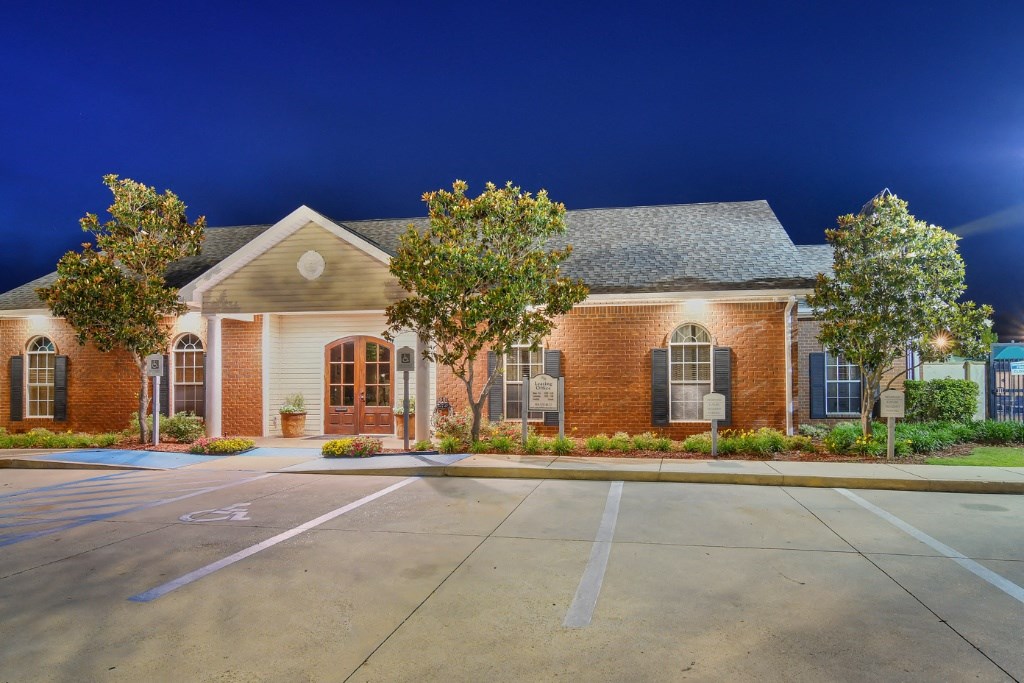 a house with a parking lot in front of it  at Landing at Willow Bayou Apartment Homes, Bossier City, Louisiana