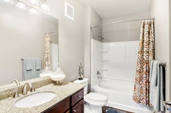 Designer Granite Countertops In All Bathrooms at Wellington Grande Apartment Homes, Longview, TX, Texas