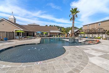 the swimming pool at the club at highland village apartments at Reserve at Gulf Hills Apartment Homes, Mississippi